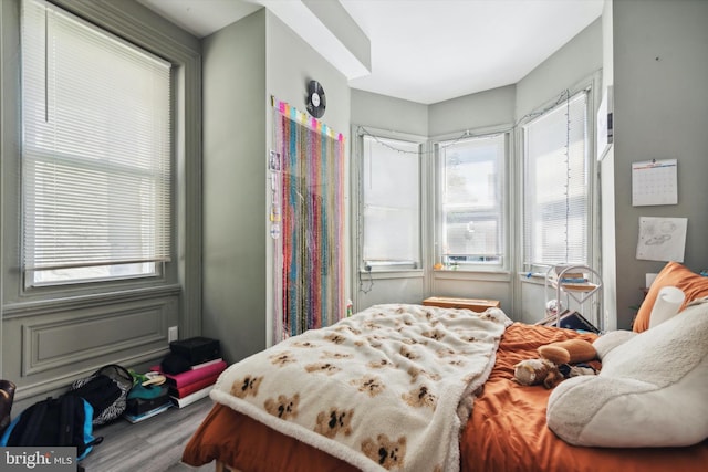 bedroom with hardwood / wood-style floors