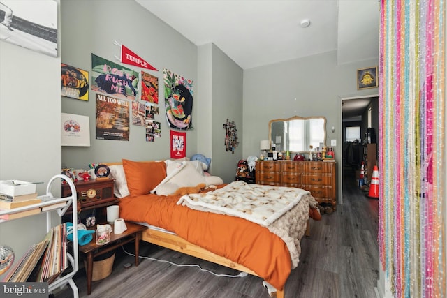 bedroom featuring dark hardwood / wood-style flooring