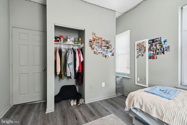 bedroom with a closet and hardwood / wood-style flooring