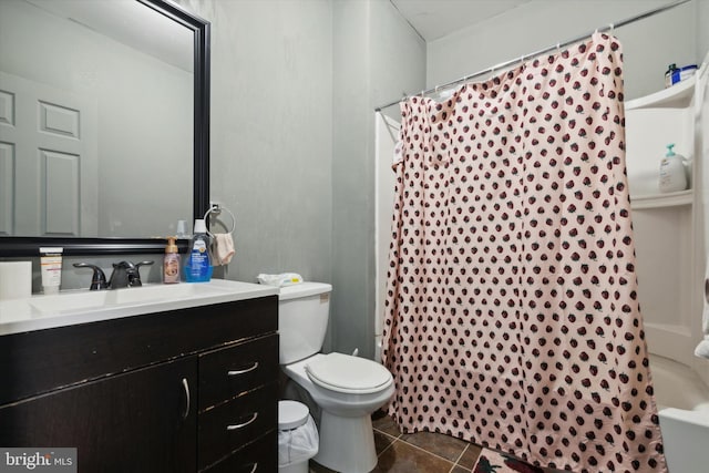 full bathroom featuring toilet, vanity, tile patterned flooring, and shower / tub combo