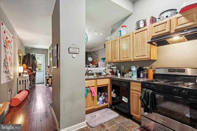 kitchen featuring light brown cabinetry, dishwasher, stainless steel range with gas stovetop, and sink