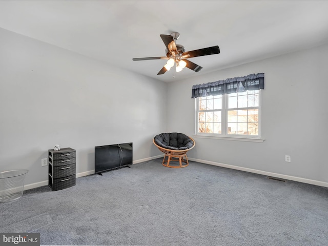 unfurnished room with ceiling fan and carpet floors