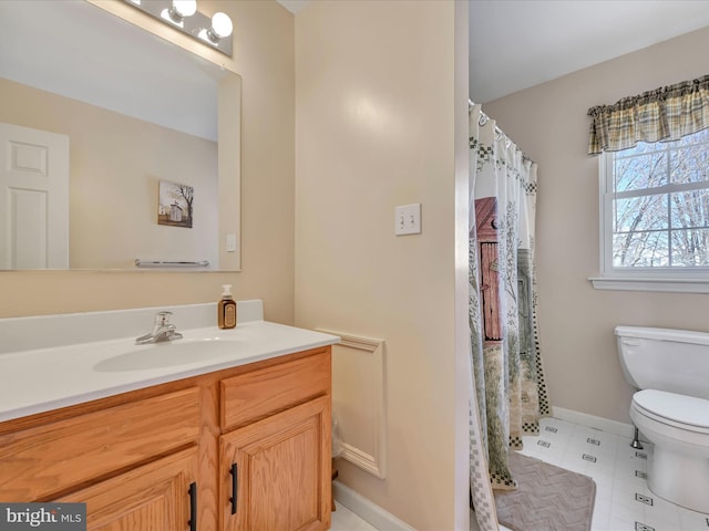 bathroom featuring vanity, toilet, and a shower with shower curtain