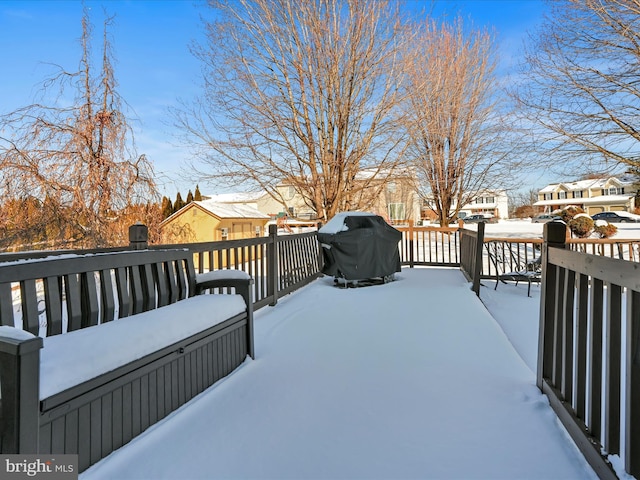 snow covered deck with grilling area