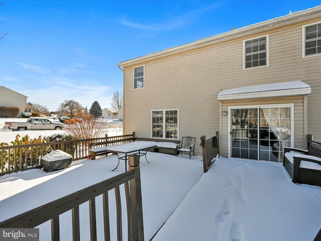 view of snow covered deck