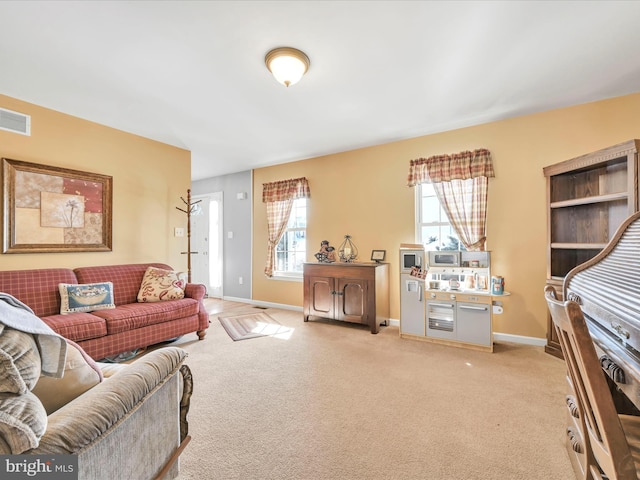 living room featuring light carpet