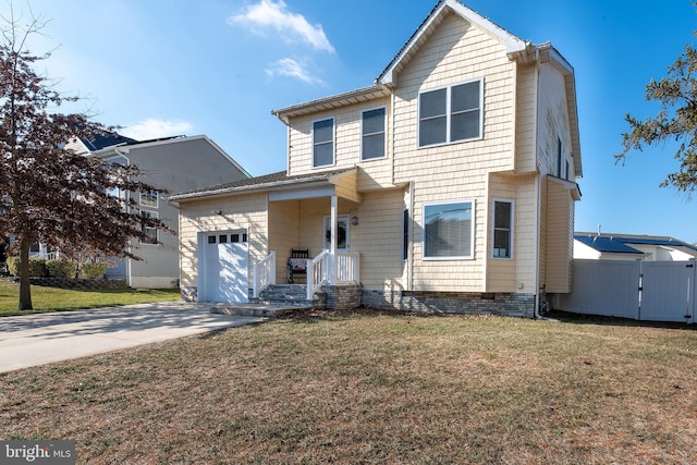 view of front property featuring a garage and a front lawn