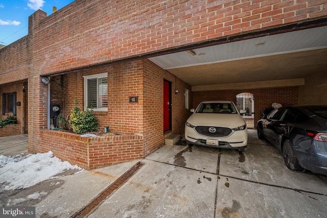 view of side of home featuring a carport