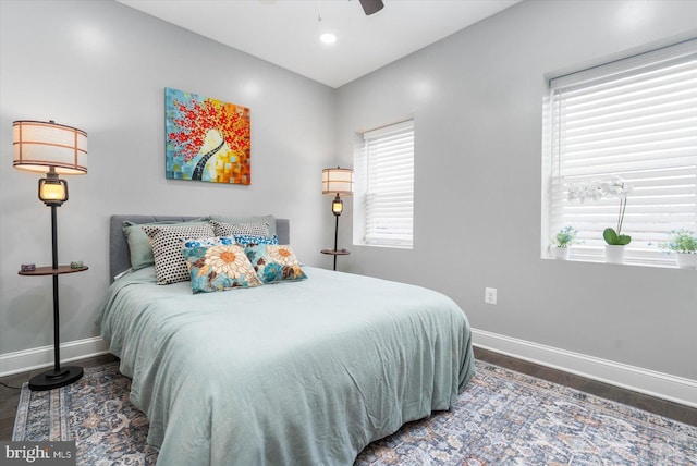 bedroom with ceiling fan and hardwood / wood-style flooring