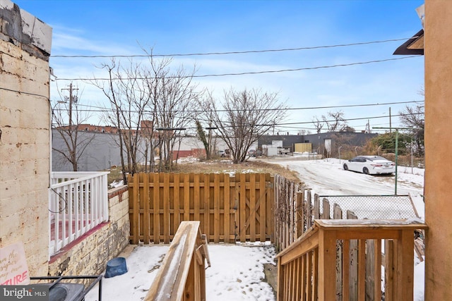 view of yard layered in snow