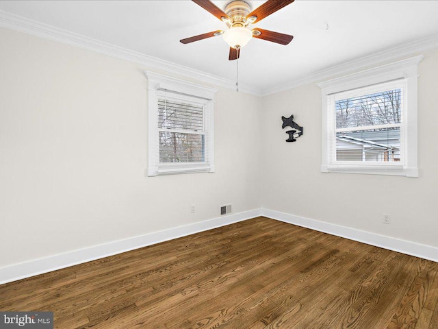 spare room with ceiling fan, ornamental molding, and hardwood / wood-style floors