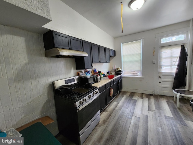 kitchen featuring light wood-type flooring and stainless steel gas stove