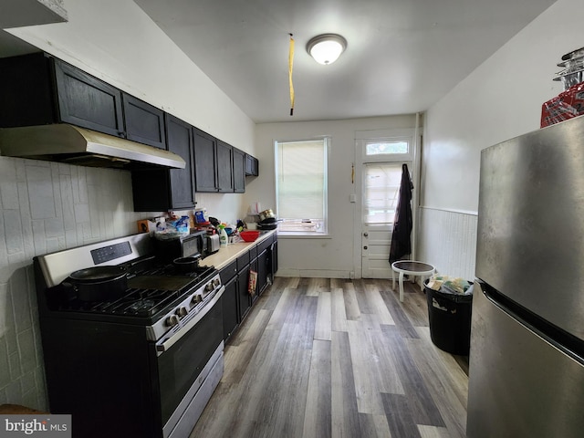 kitchen featuring hardwood / wood-style flooring and stainless steel appliances