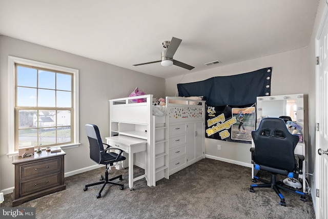 bedroom with ceiling fan and dark colored carpet