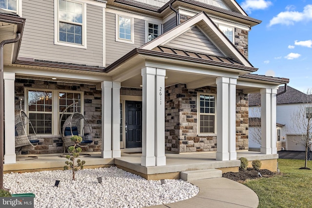 doorway to property featuring a porch