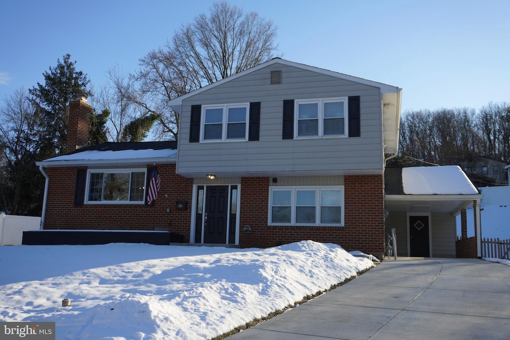 view of front of home with a carport