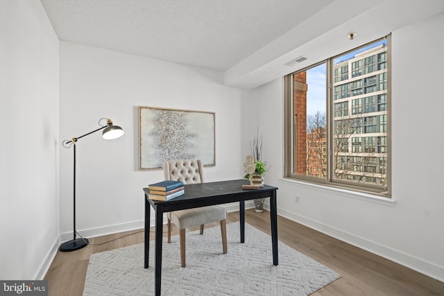 home office featuring light hardwood / wood-style floors