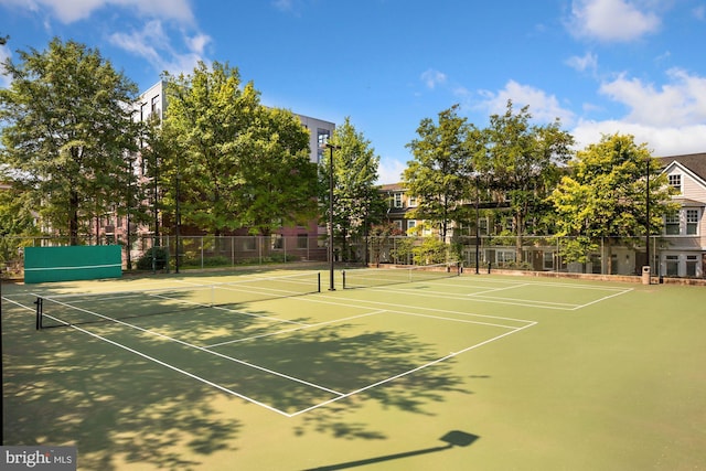 view of sport court with basketball hoop