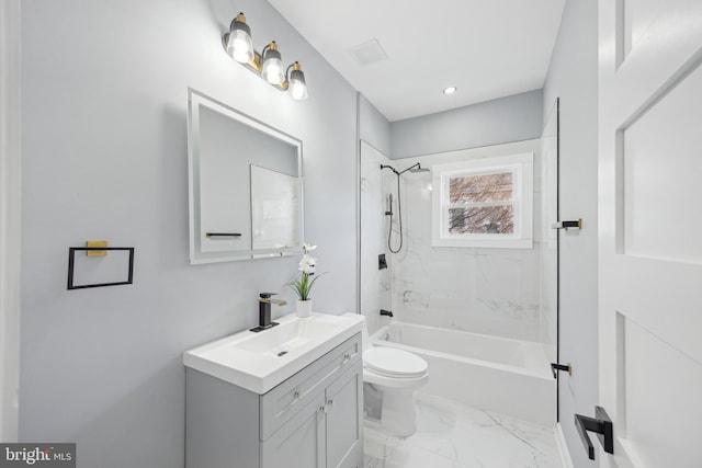 full bathroom with toilet, tiled shower / bath, and vanity