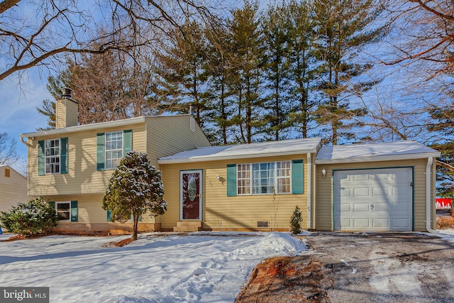 split level home featuring a garage