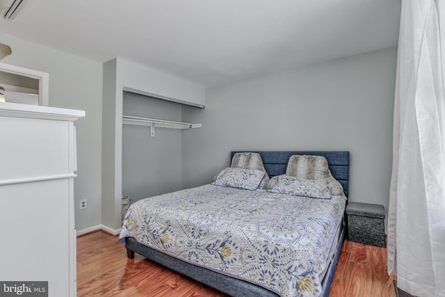 bedroom featuring a closet and hardwood / wood-style floors