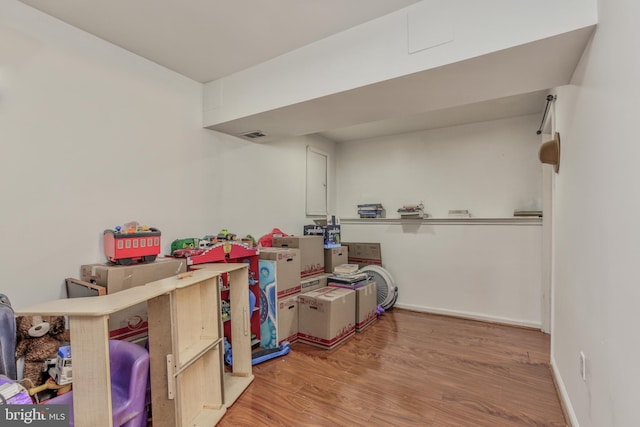 basement featuring light hardwood / wood-style flooring