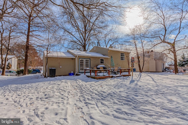 view of snow covered house