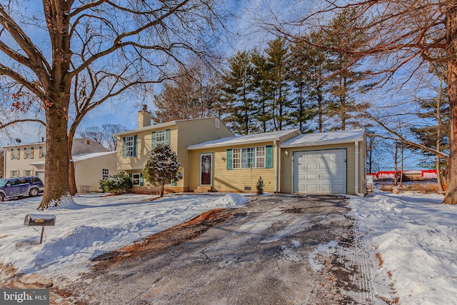 split level home featuring a garage