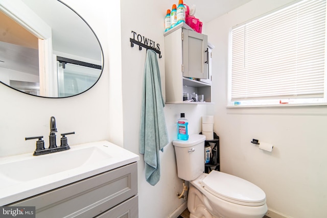 bathroom featuring vanity and toilet