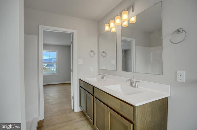 bathroom with vanity and hardwood / wood-style floors