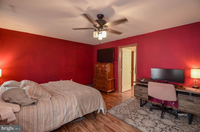 bedroom featuring light wood-type flooring and ceiling fan