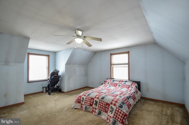 carpeted bedroom featuring ceiling fan and lofted ceiling