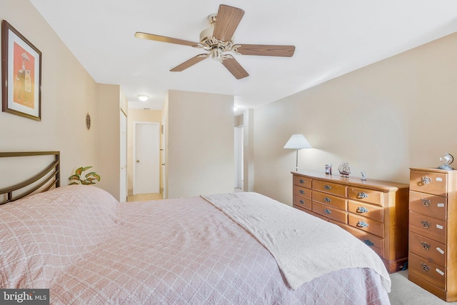 bedroom featuring ceiling fan and ensuite bathroom