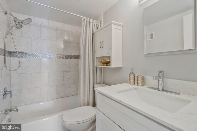 full bathroom featuring toilet, vanity, and shower / bath combination with curtain