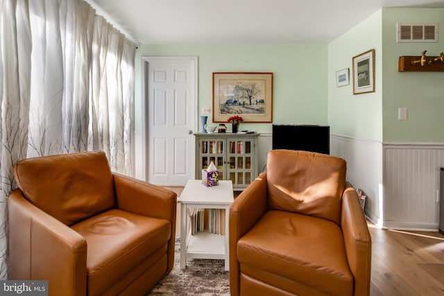 living area featuring hardwood / wood-style floors