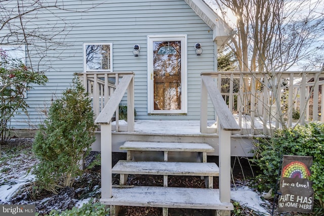 entrance to property with a wooden deck