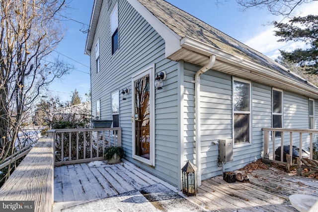 view of side of property with a wooden deck