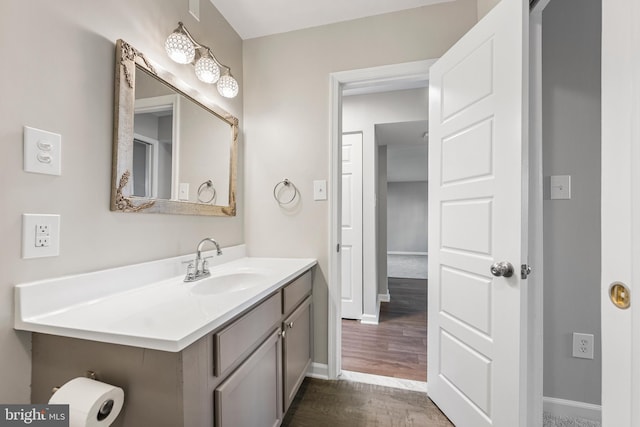 bathroom with vanity and hardwood / wood-style floors