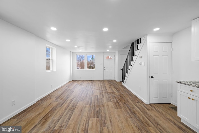 interior space with hardwood / wood-style flooring