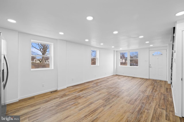 unfurnished living room featuring light hardwood / wood-style flooring