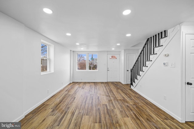 foyer entrance with dark hardwood / wood-style floors