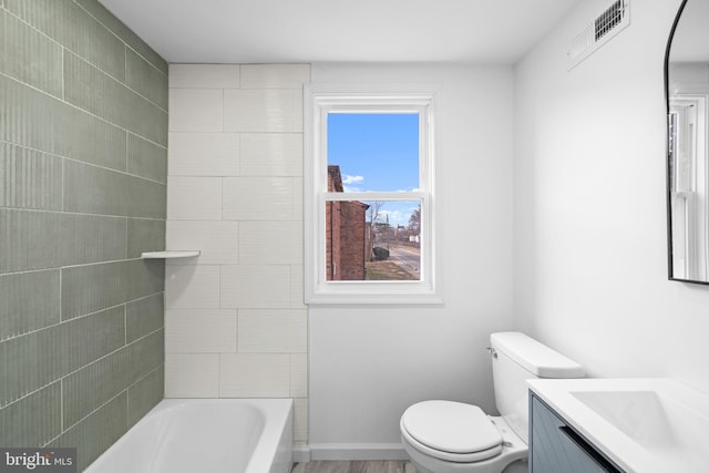 bathroom featuring toilet and vanity