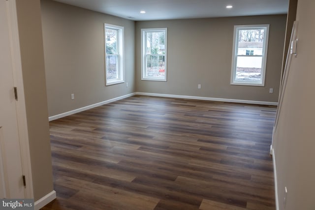 unfurnished room featuring dark hardwood / wood-style floors