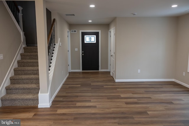 foyer entrance featuring dark hardwood / wood-style floors