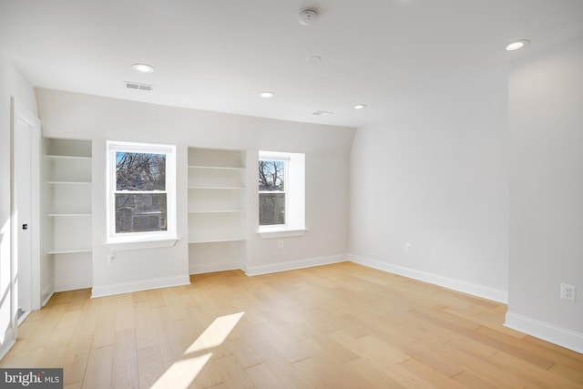 unfurnished room featuring light wood-type flooring