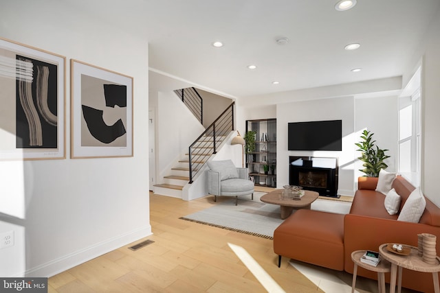 living room with light hardwood / wood-style floors