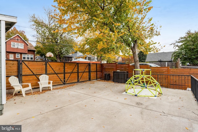 view of patio featuring a playground