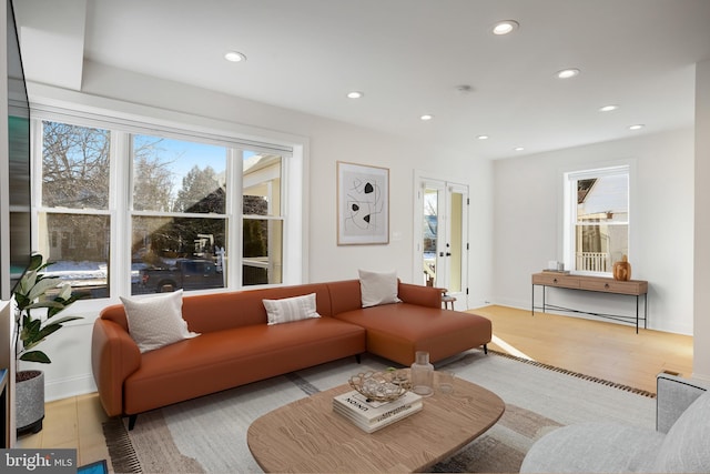 living room featuring light hardwood / wood-style flooring and french doors