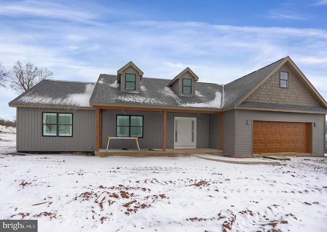 view of front of house featuring covered porch and a garage