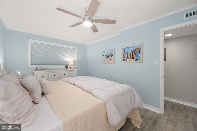 bedroom featuring crown molding, ceiling fan, and light wood-type flooring